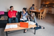 UBC Fraser Hall residents relax and socialize in a living room space.