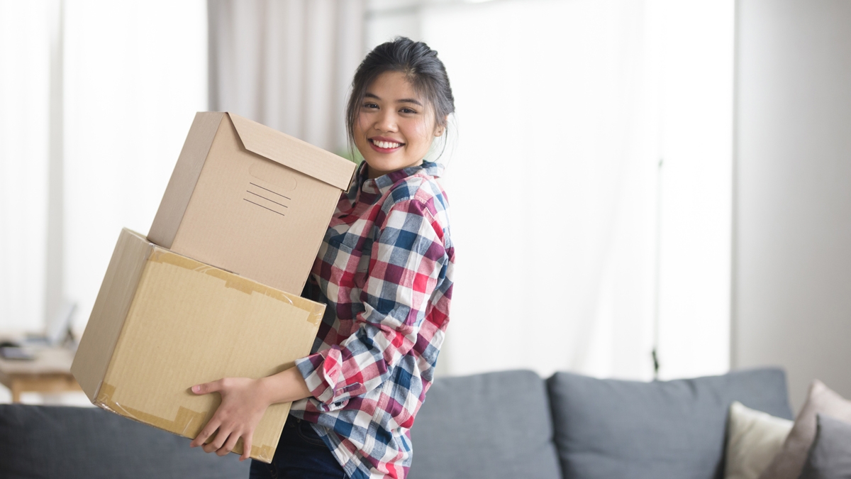 Young woman with moving boxes