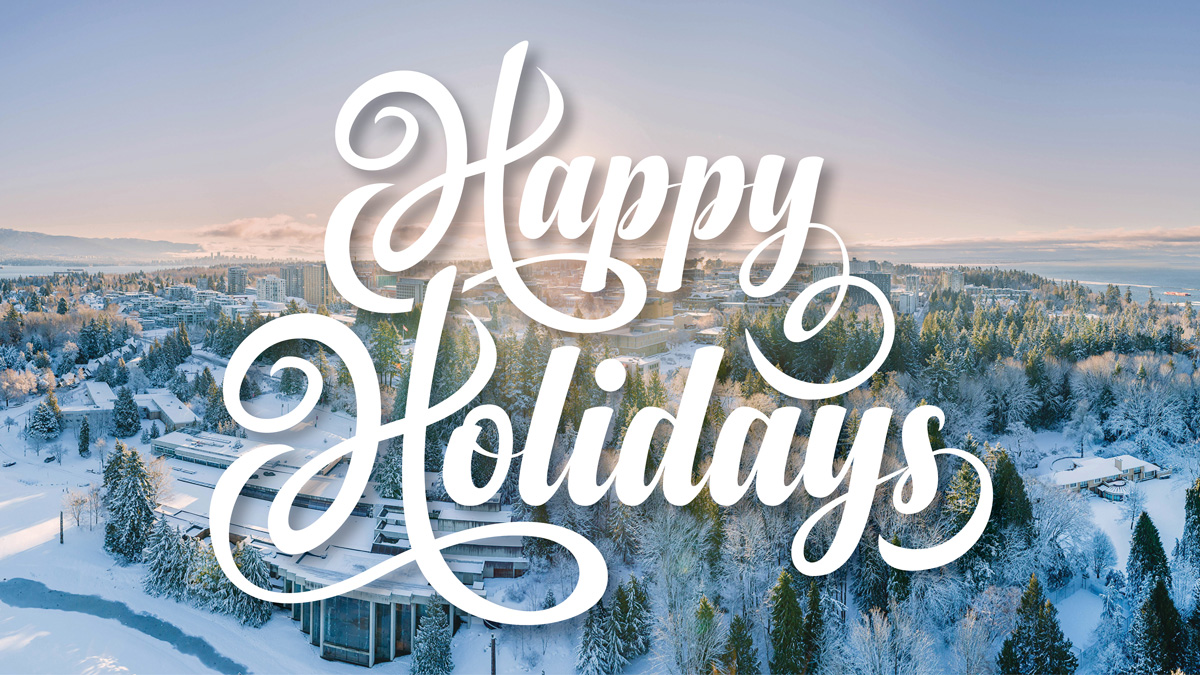 "Happy Holidays" text on snowy aerial photograph of UBC